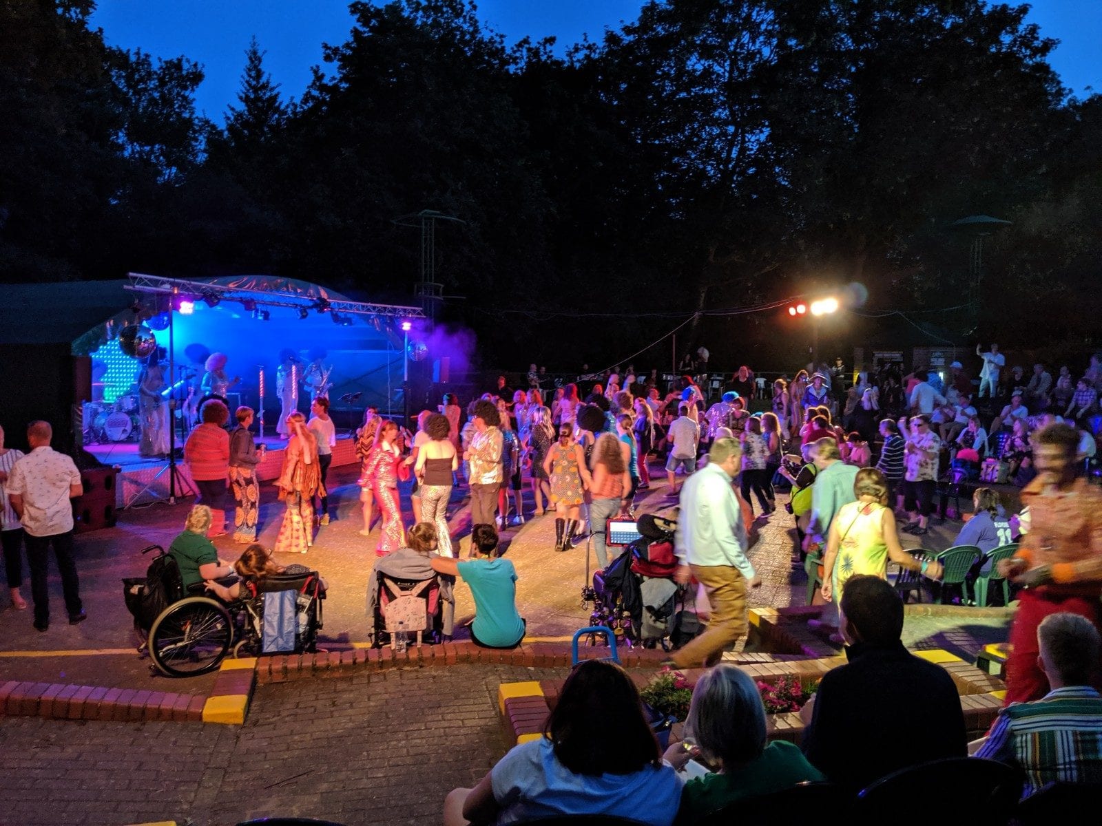 The open-air theatre lit up at night during a show